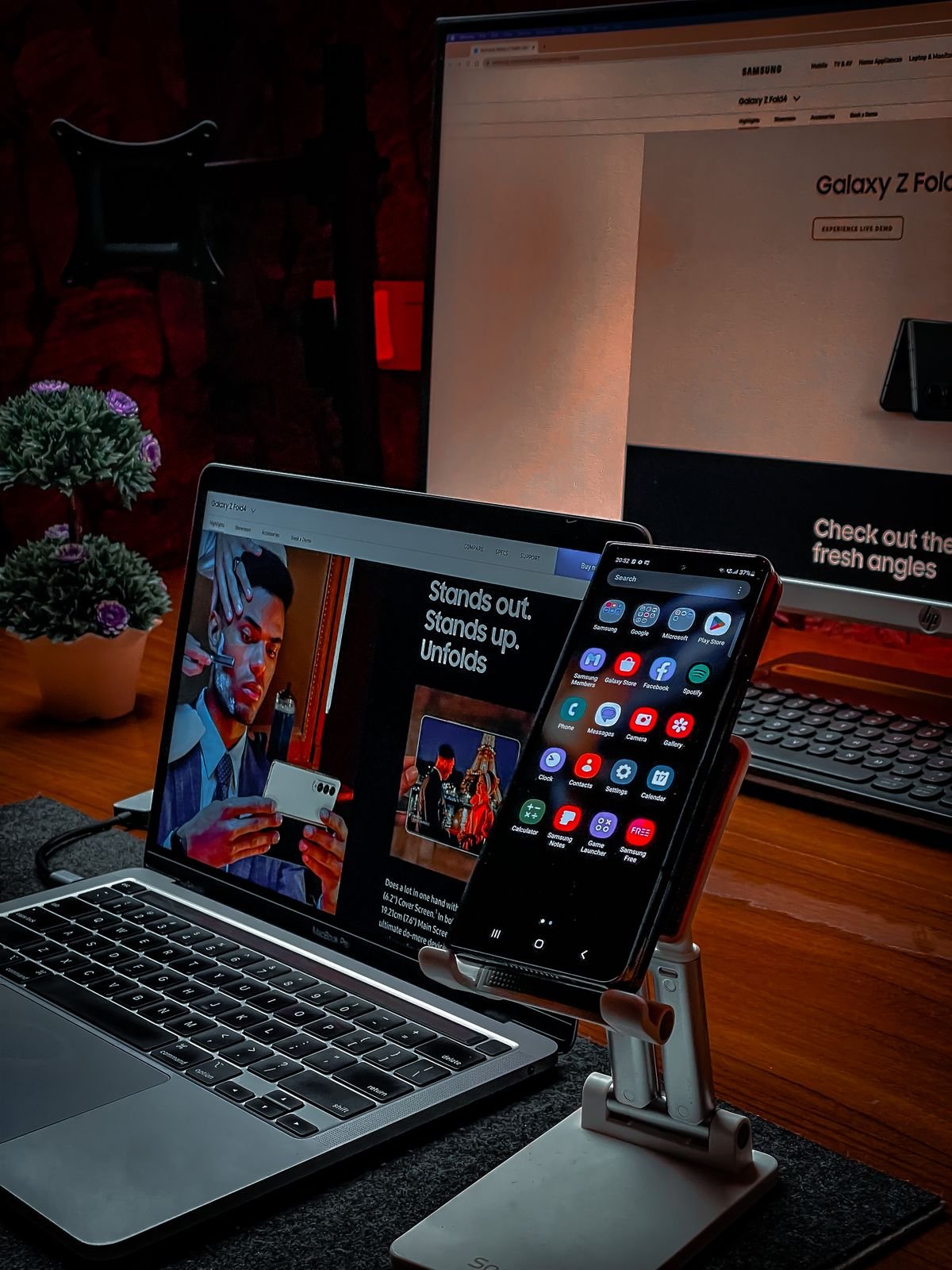 Laptop and smartphone on an office desk, representing a home care agency managing its service and location pages online